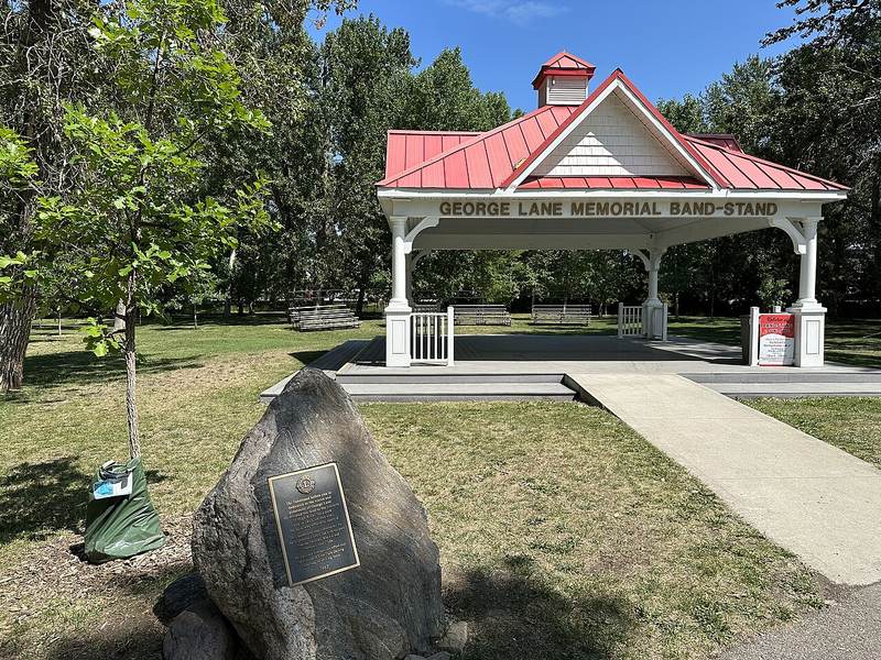 The red-roofed George Lane Memorial Band-Stand in George Lane Memorial Park, High River